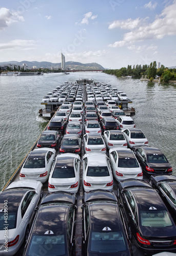Photography big boat carying a lot of cars on Danube river, Vienna
