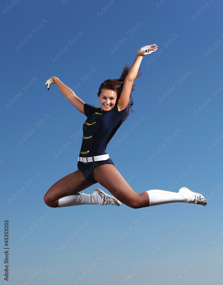 Young female dancer against white background Young female dancer against white background