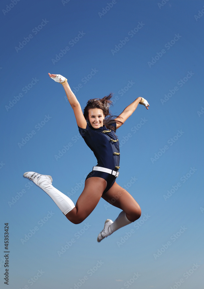 Young female dancer against white background Young female dancer against white background