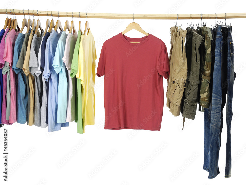 Variety of casual shirts and jeans on wooden hangers