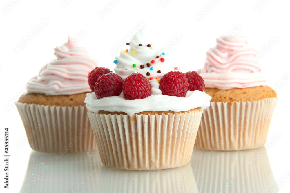 tasty cupcakes with berries, isolated on white