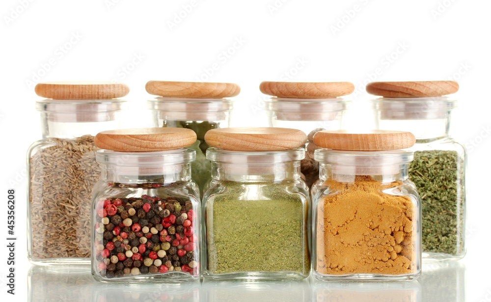 powder spices in glass jars isolated on white powder spices in glass jars isolated on white
