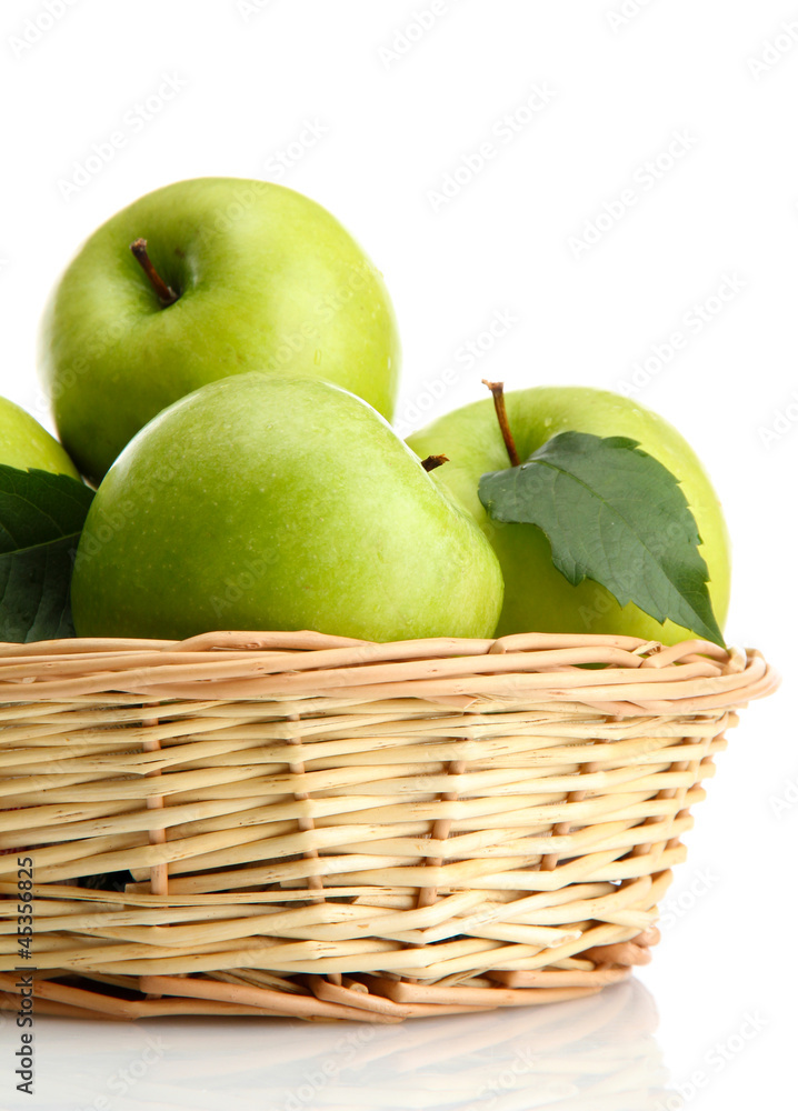 Ripe green apples with leaves in basket isolated on white Ripe green apples with leaves in basket isolated on white