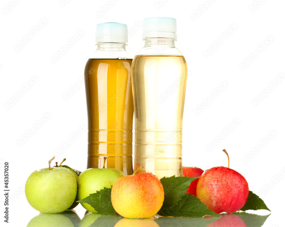 two bottles of juice with sweet apples, isolated on white two bottles of juice with sweet apples, isolated on white