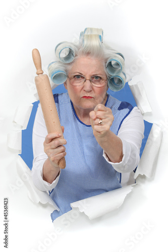 Angry old woman with a rolling pin
