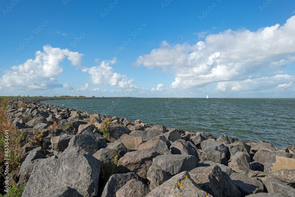 Dike along a lake in autumn