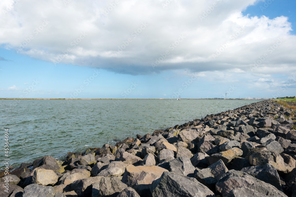 Dike along a lake in autumn