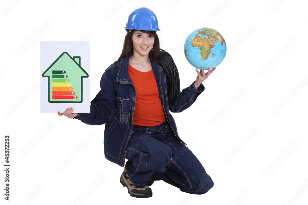 female electrician holding globe female electrician holding globe