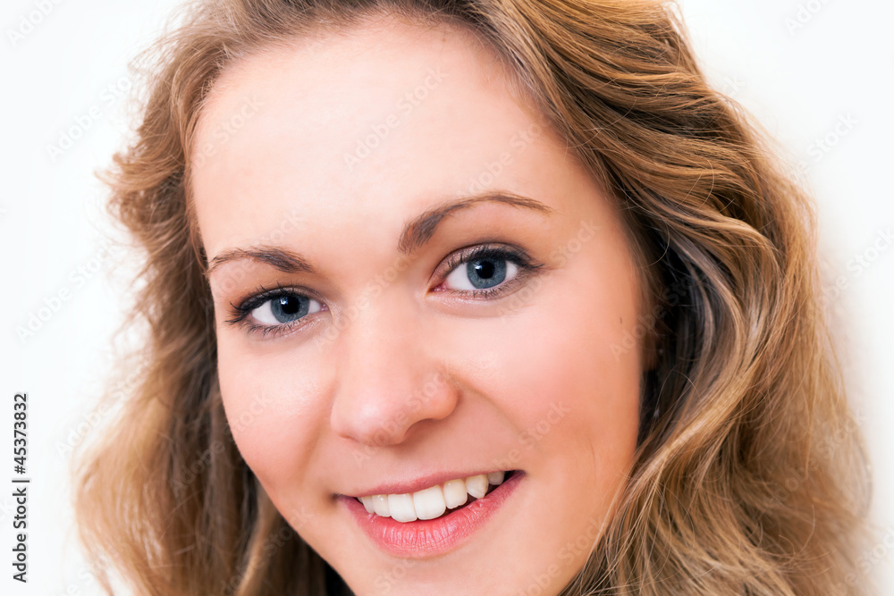 Close up portrait of a young smiling woman Close up portrait of a young smiling woman