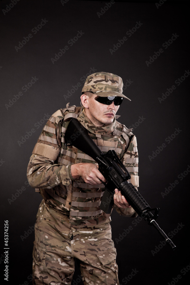 Fototapeta premium Modern soldier with rifle