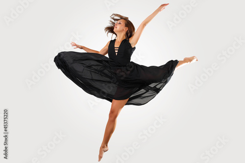 Young female dancer jumping