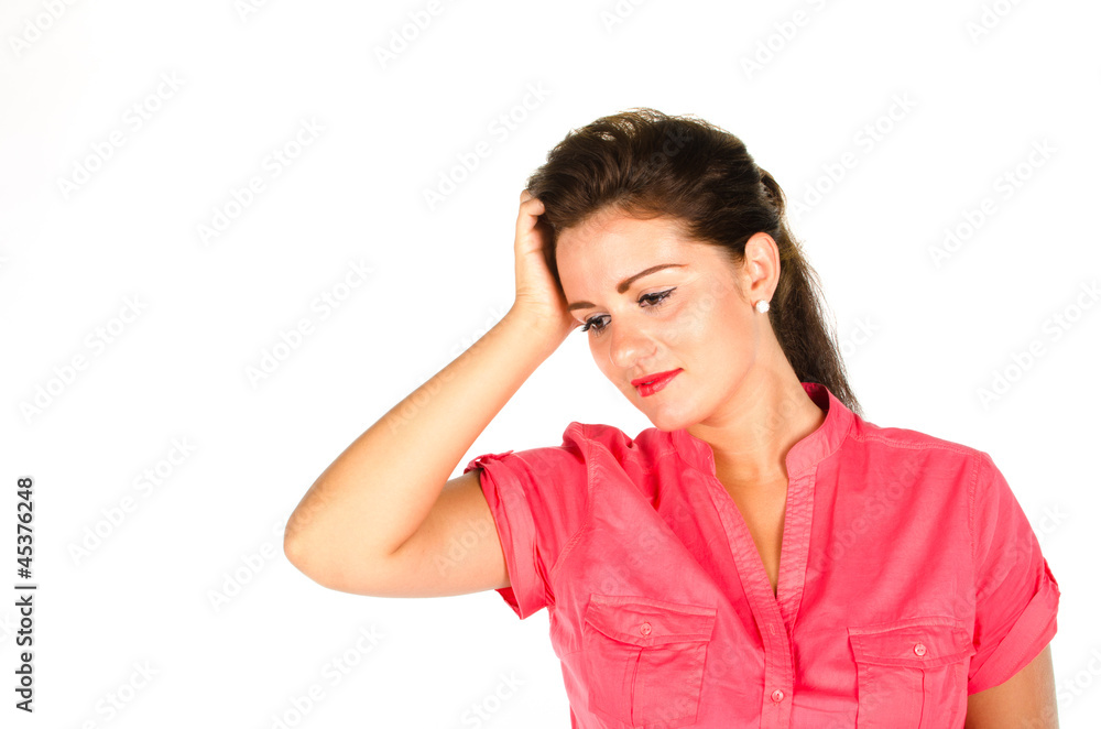Young woman holding her head and looking down Young woman holding her head and looking down