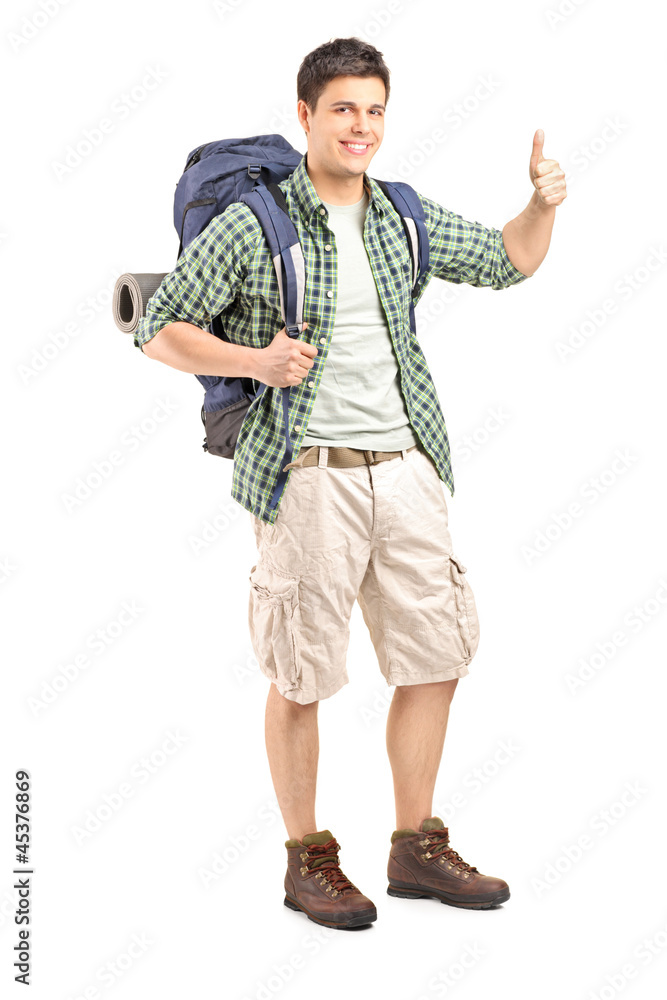 Male hiker with backpack giving a thumb up Male hiker with backpack giving a thumb up