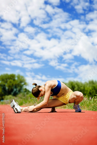 Athlete woman stretching