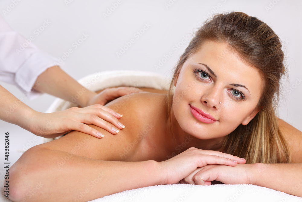 Closeup of an attractive young woman receiving massage Closeup of an attractive young woman receiving massage