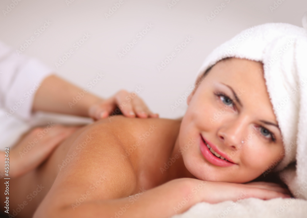 Closeup of an attractive young woman receiving massage Closeup of an attractive young woman receiving massage