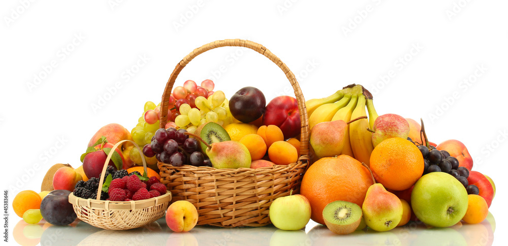 Assortment of exotic fruits and berries in baskets isolated Assortment of exotic fruits and berries in baskets isolated