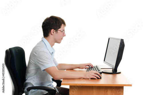 The businessman behind a table with the computer