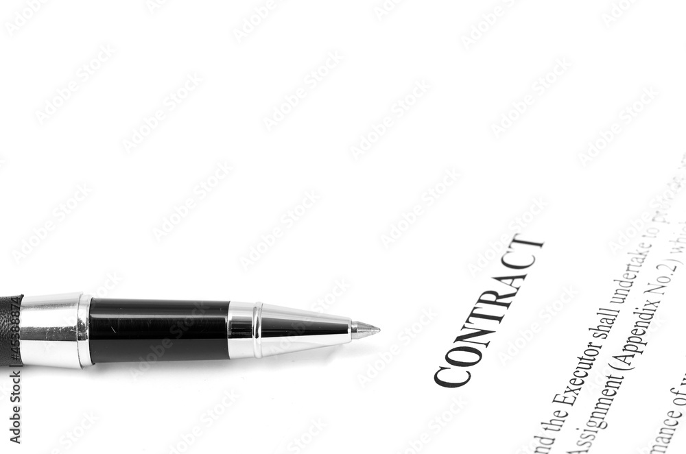 Close-up of silver pen on contract. Close-up of silver pen on contract.
