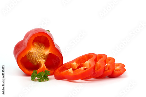 Slika na platnu Cut red pepper isolated on white background, closeup