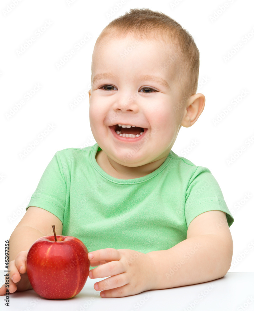 Portrait of a cute cheerful little boy with apple Portrait of a cute cheerful little boy with apple