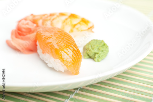 Nigiri sushi on the plate with wasabi sauce. Japanese meal