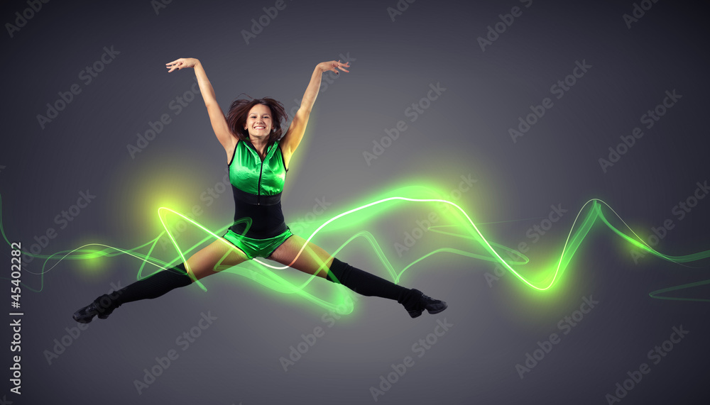 Young woman dancer. With lights effect.