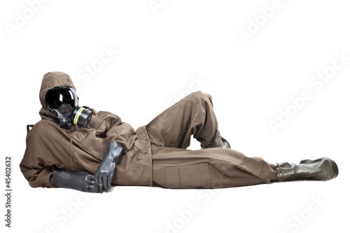 Fotografía Man in Hazard Suit layng on the ground