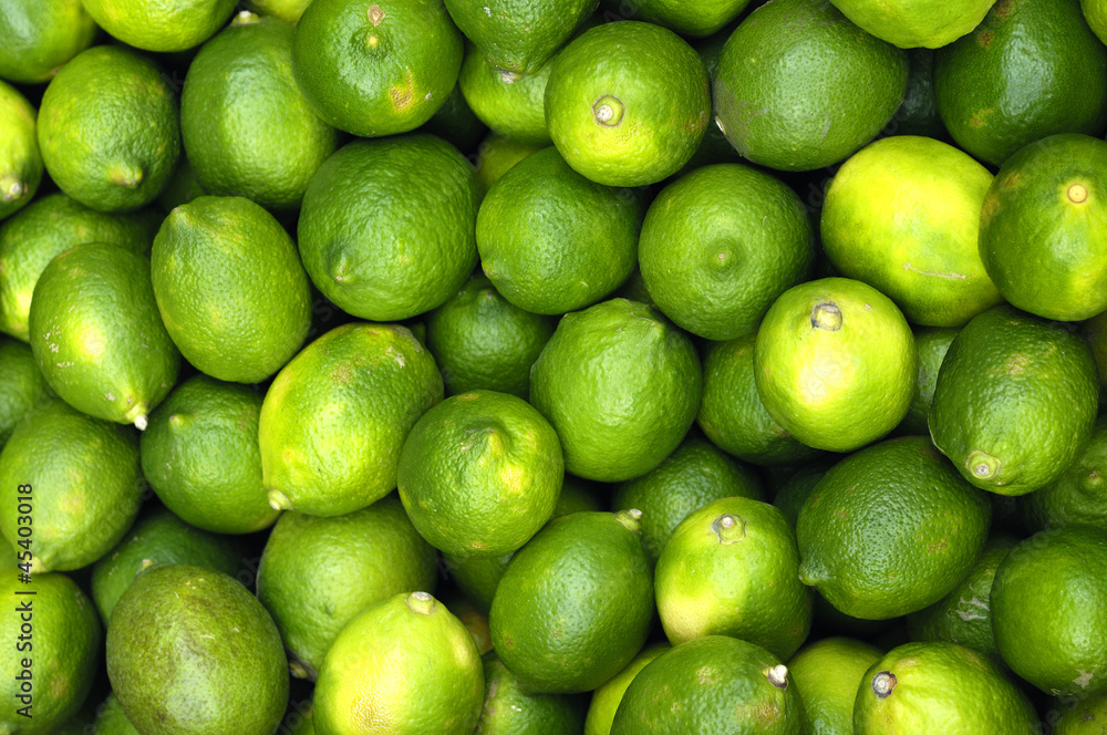 Fresh and green lemons background Fresh and green lemons background