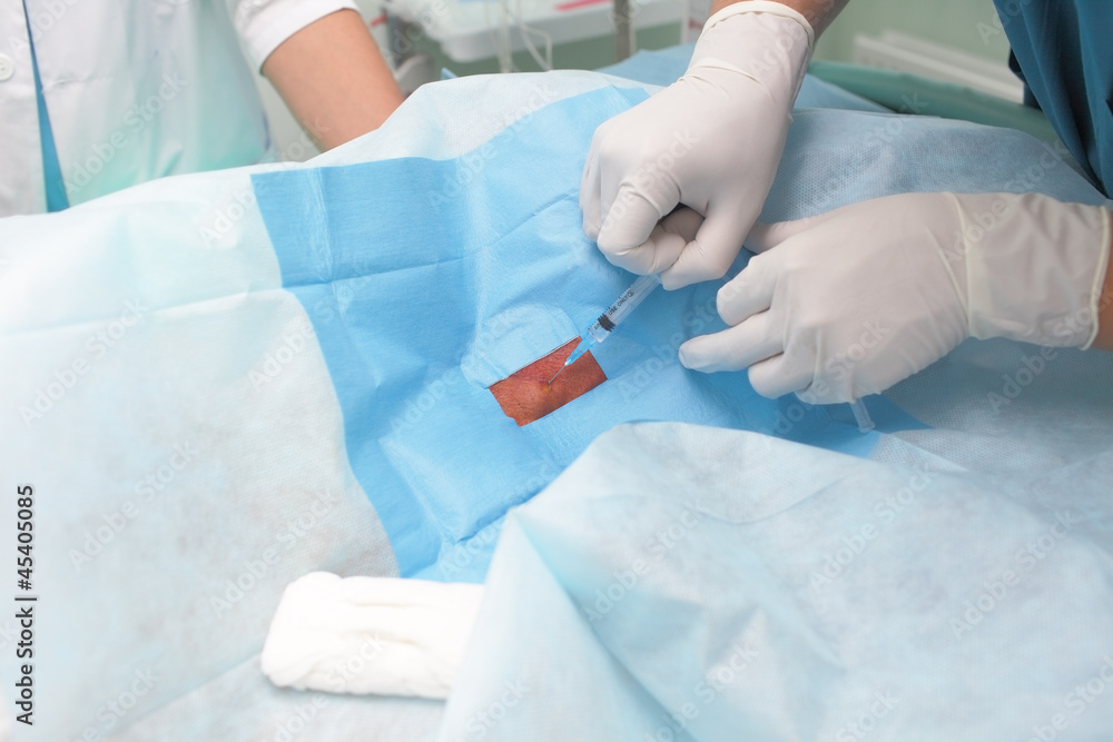Fototapeta premium Doctor giving an injection to a patient