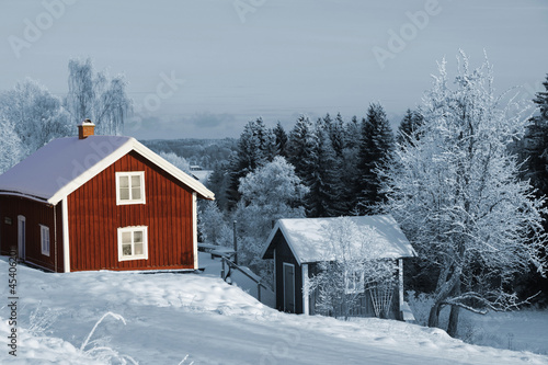 old red cottages in winter, sweden © christian42