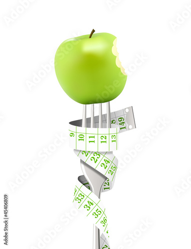 Mètre vert, fourchette, pomme croquée