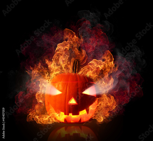  Burning halloween pumpkin, isolated on black background