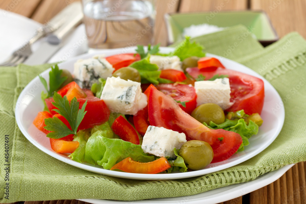 salad with cheese gorgonzola on the plate