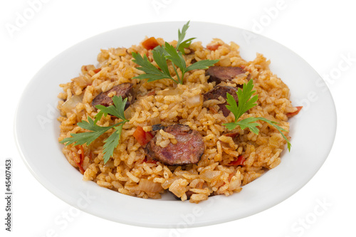 sausages with rice on white plate