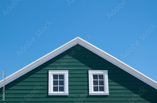 Green house and white roof with blue sky in sunny day