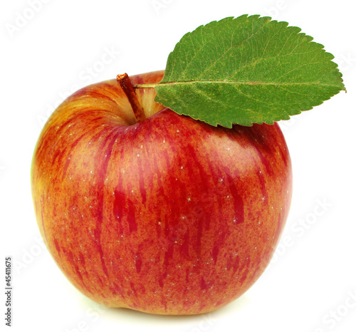 Ripe apple with a leaf
