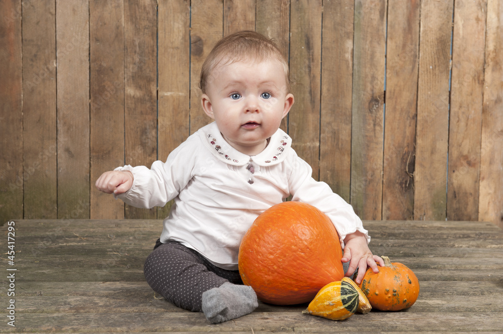 Fototapeta premium halloween baby with pumpkins