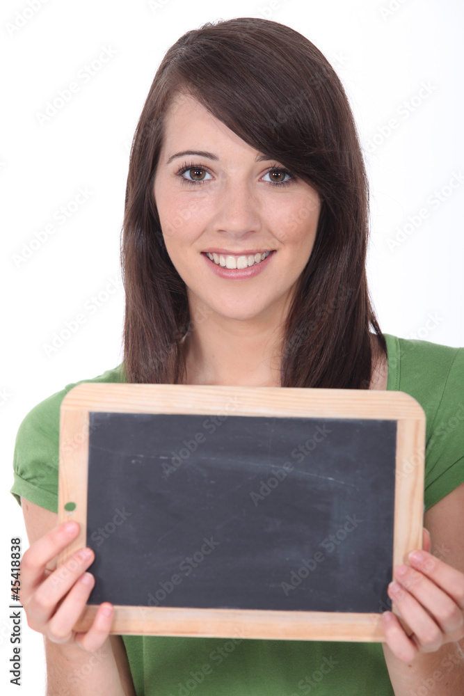 woman holding a blackboard left blank for a message woman holding a blackboard left blank for a message