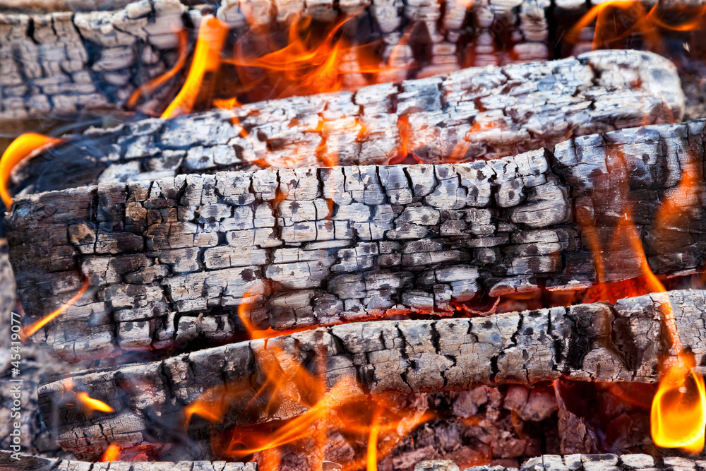 Closeup of a warm fire burning in a fireplace Closeup of a warm fire burning in a fireplace