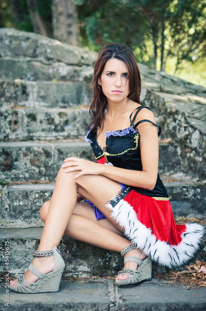 Beautiful girl portrait. Sit on stone stairs. Beautiful girl portrait. Sit on stone stairs.