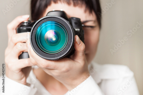 Woman photographer with camera photo