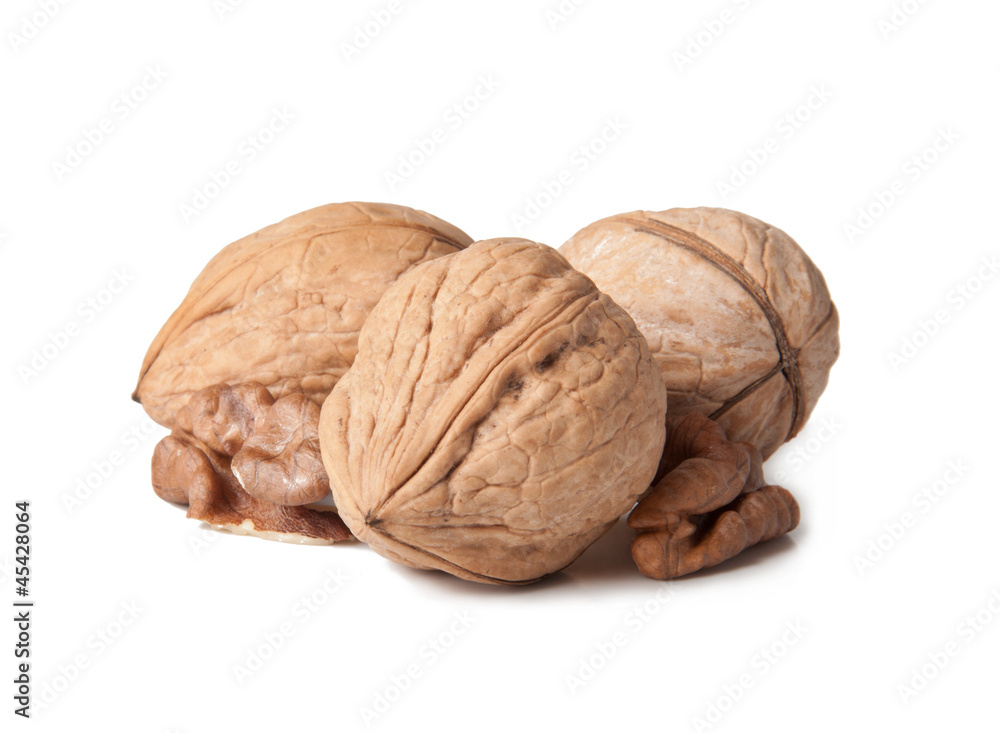 Walnut and a cracked walnut isolated on the white background Walnut and a cracked walnut isolated on the white background