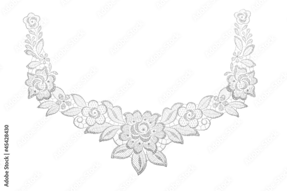 Fototapeta premium Embroidered lace trim over white. Fabric texture.