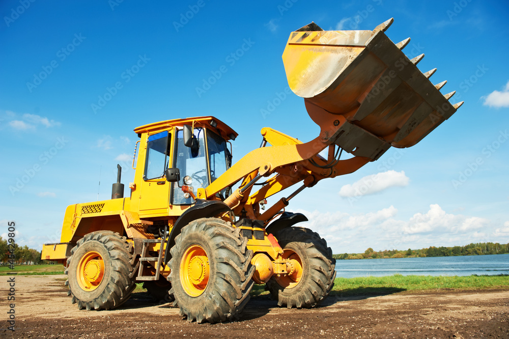 Obraz premium wheel loader excavator at work