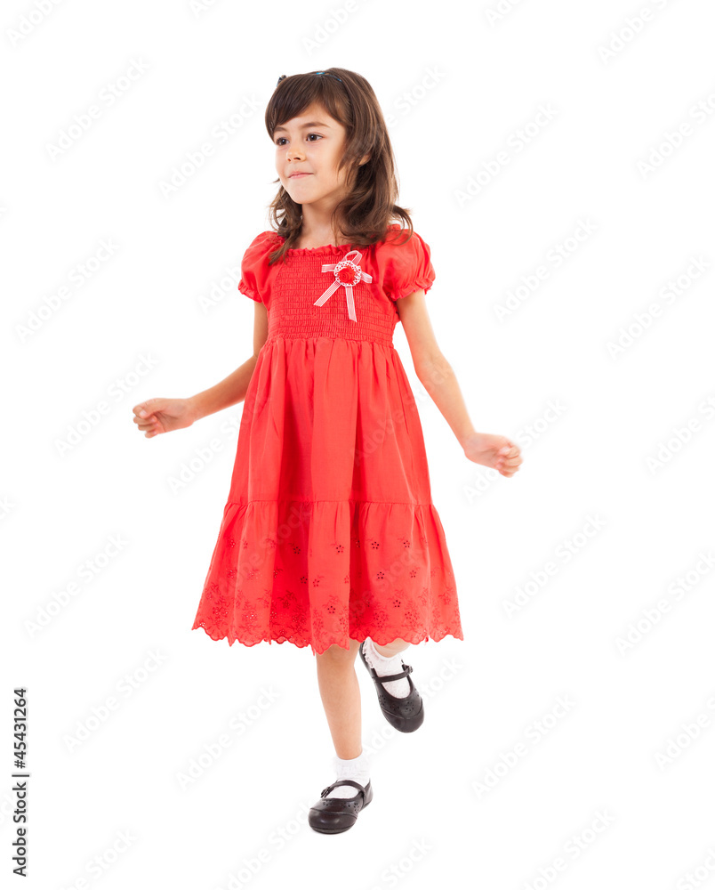 Happy little girl playing in studio