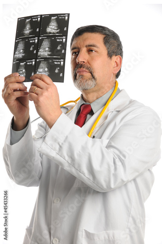 Hispanic Doctor Examining Ultrasound Film