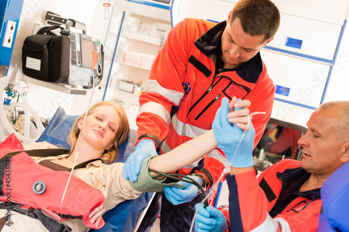 Emergency doctor measure blood pressure ambulance