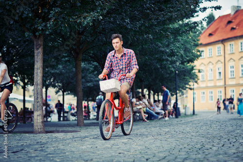 young man riding a fixie photo