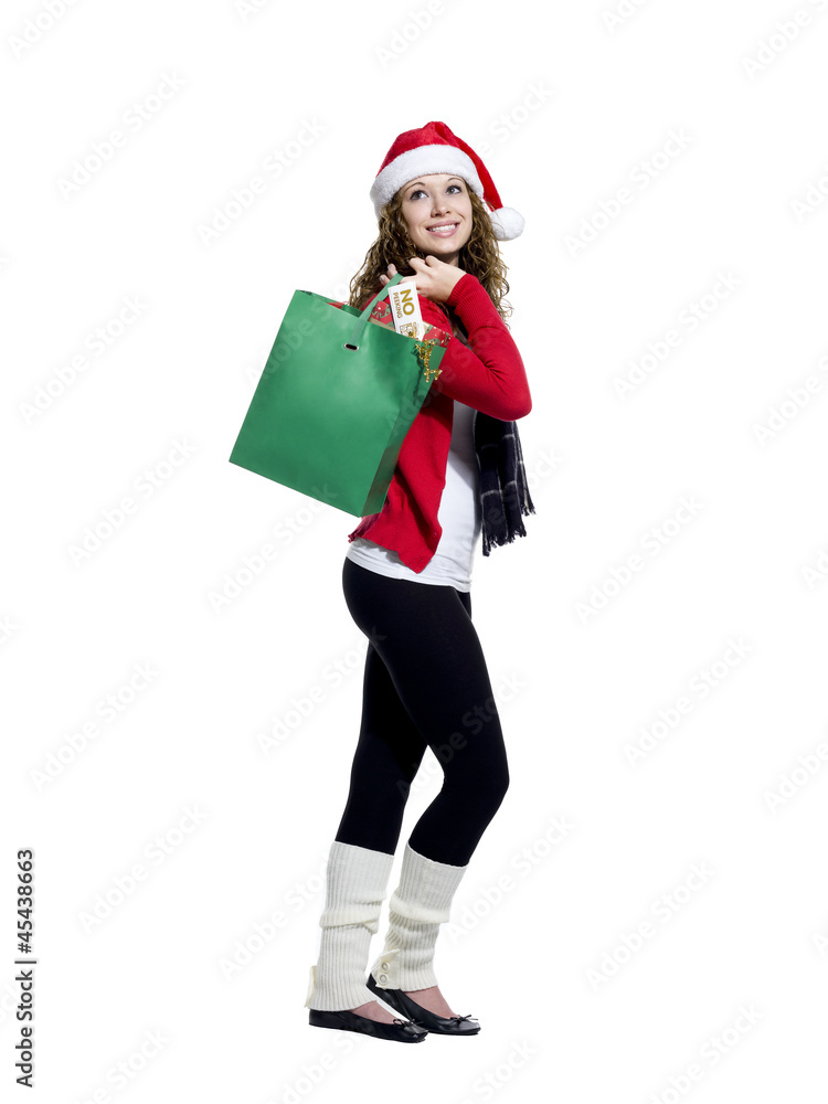 side view of a young woman with shopping bags looking away